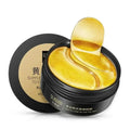 Gold eye masks in a black container with brand name on a white background
