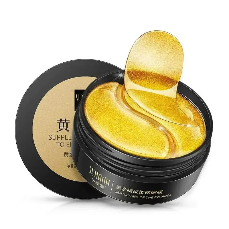 Gold eye masks in a black container with brand name on a white background