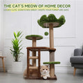 Cat tree with a cat sitting on it in a room with a plant and chair.