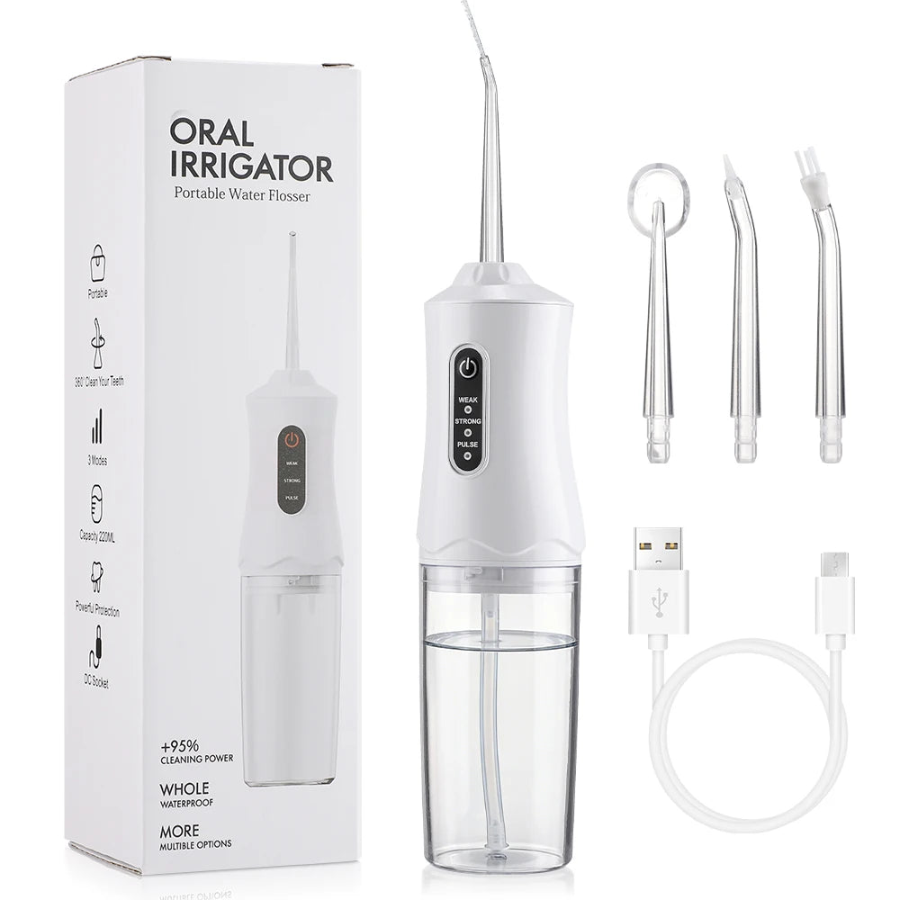 Portable water flosser with packaging, nozzles, and USB cable on a white background