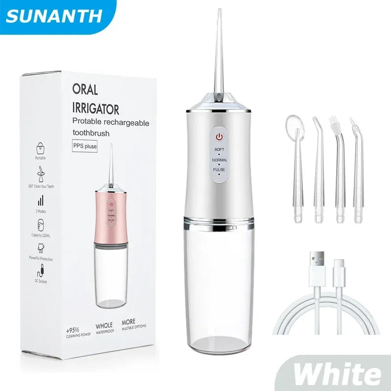 White portable rechargeable toothbrush with packaging and accessories on a white background