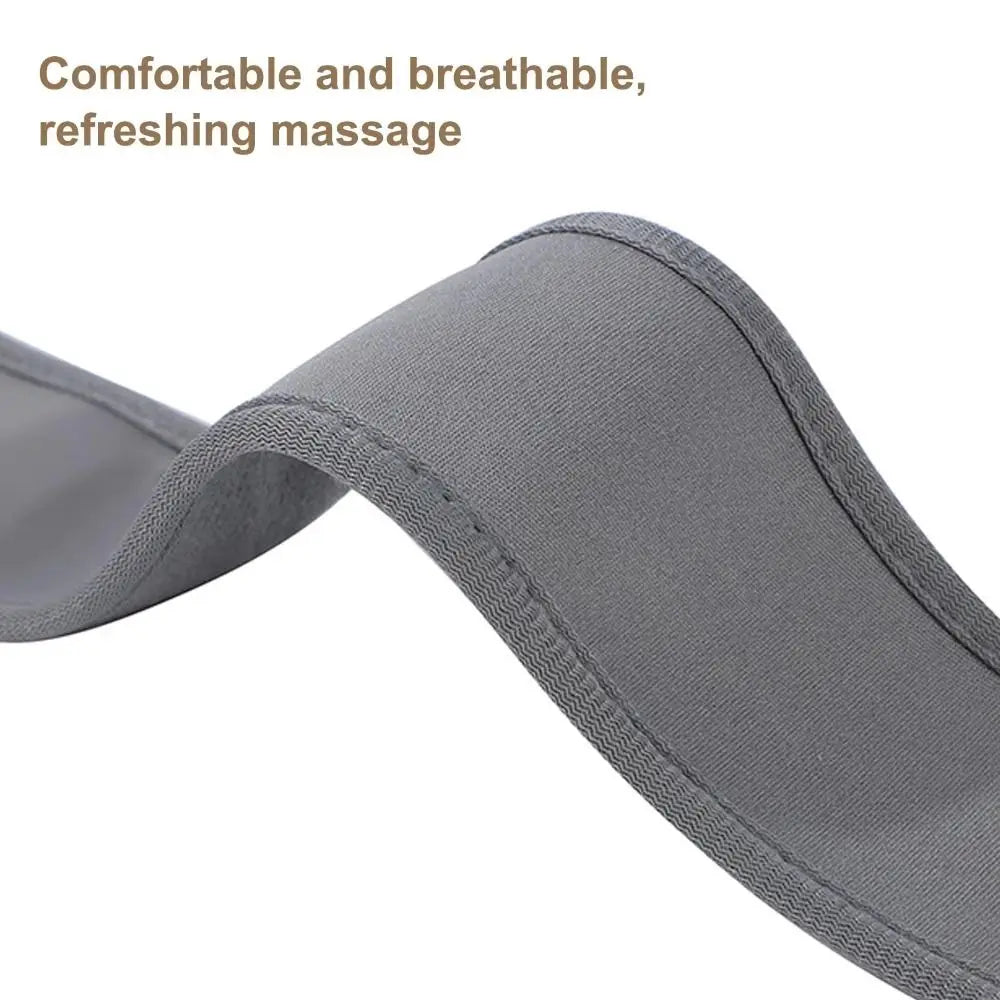 A close-up of a gray fabric massage strap or pad with stitched edges, shown on a white background with the text 'Comfortable and breathable, refreshing massage' in brown at the top left.