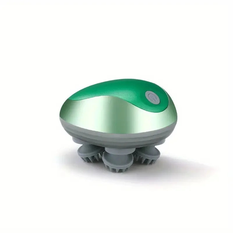 A handheld electric scalp massager with a metallic green and silver top dome and gray massage bristles, shown on a clean white background.