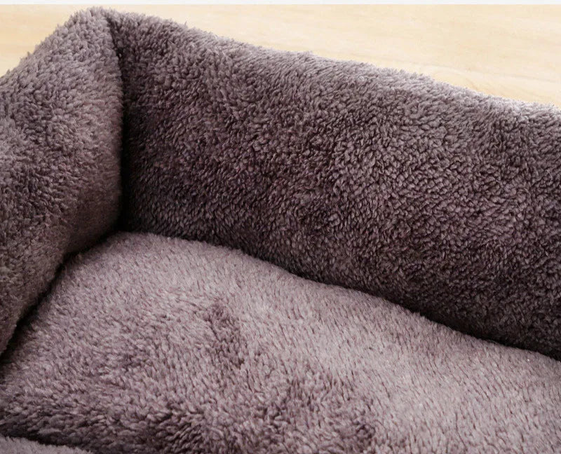Close-up of a textured gray fabric with visible pilling.