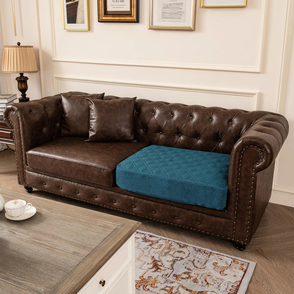 Brown leather sofa with a blue pet bed in a living room setting.