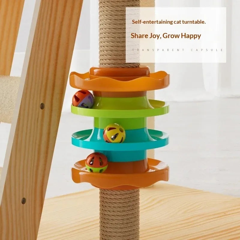 Colorful cat toy turntable with wooden post on a light background