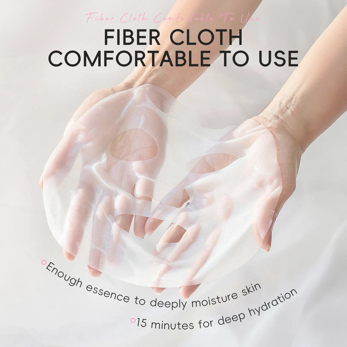 A pair of hands wearing a translucent white fiber cloth mask, with promotional text overlays reading 'FIBER CLOTH COMFORTABLE TO USE' and additional benefit copy on a soft white background.