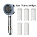 A chrome handheld shower head with a blue-gray silicone brush head is shown next to five white cylindrical filter cartridges on a plain white background, with the text '5pcs filter cartridges' above.