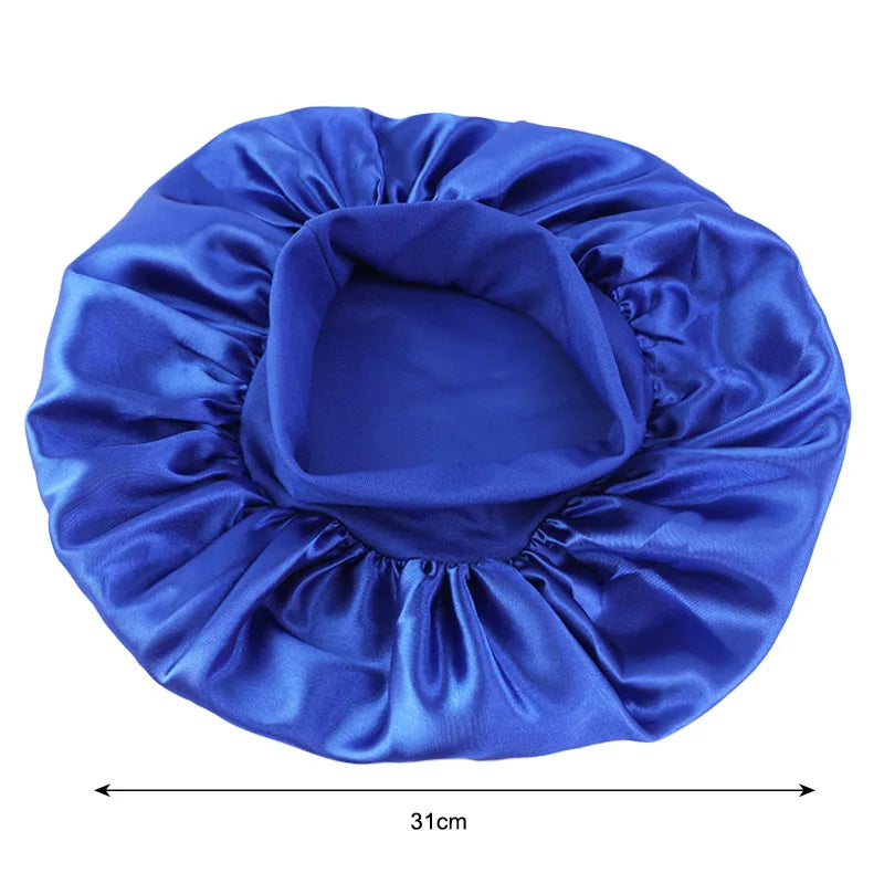 Blue satin hair bonnet with measurement label on a white background