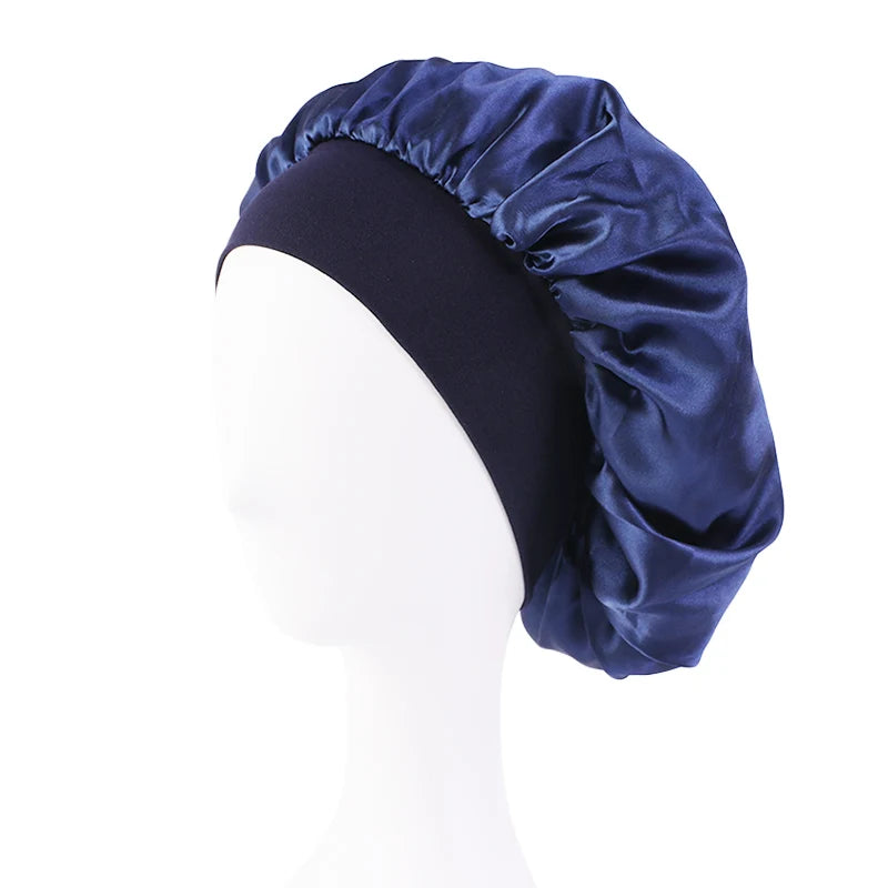 Navy blue satin bonnet on a white mannequin head