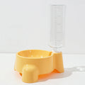 Yellow pet feeder with a clear water bottle on a white background