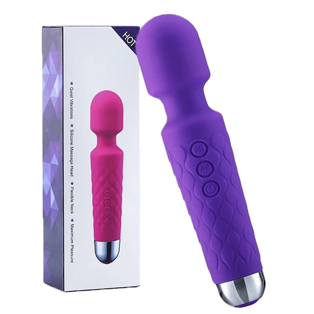 Purple and pink massager with packaging on a white background