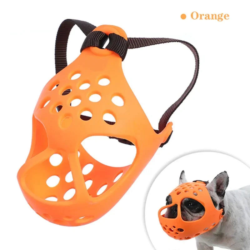 Orange dog muzzle with black strap on a white background