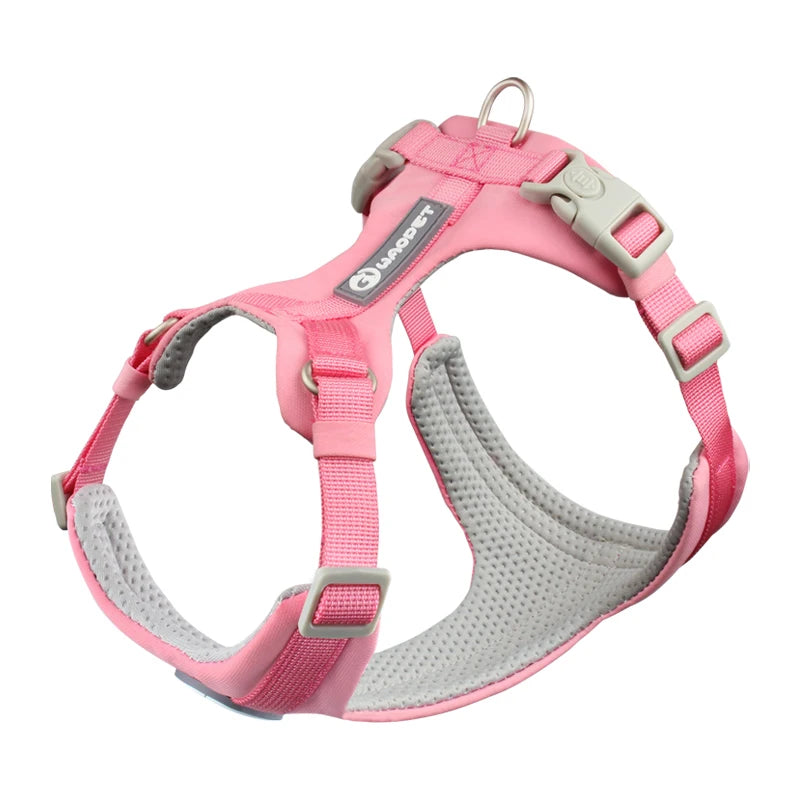 Pink dog harness with gray padding on a white background