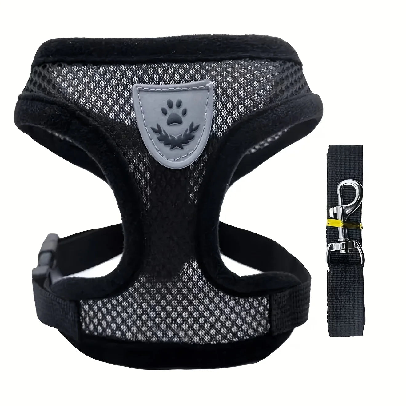 Black and gray dog harness with a matching leash on a white background