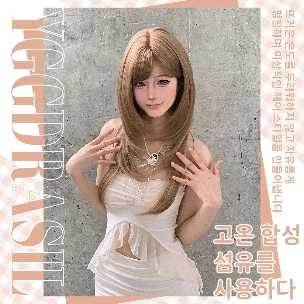 A woman modeling a long, straight light brown wig with bangs, wearing a white dress and posing against a textured gray concrete wall. The image features promotional text overlays in Korean and English ('MGBASIL') on the borders.
