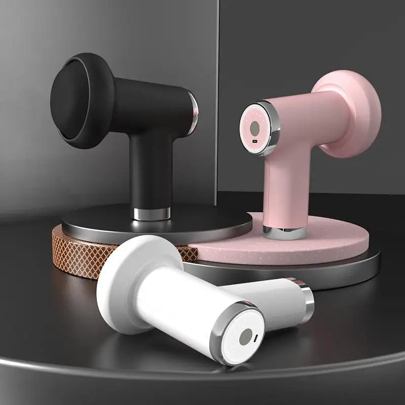 Three handheld devices in black, pink, and white on a dark surface with a reflective background.