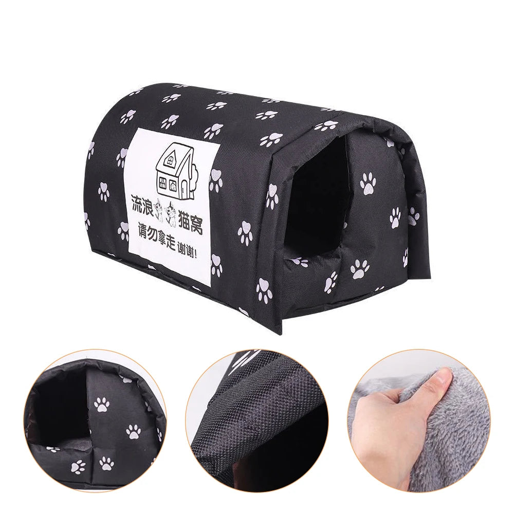 Black pet bed with white paw prints and a label on a white background