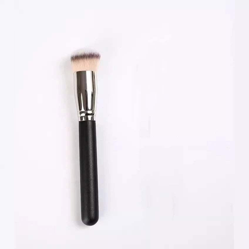 Makeup brush with black handle and silver ferrule on a white background