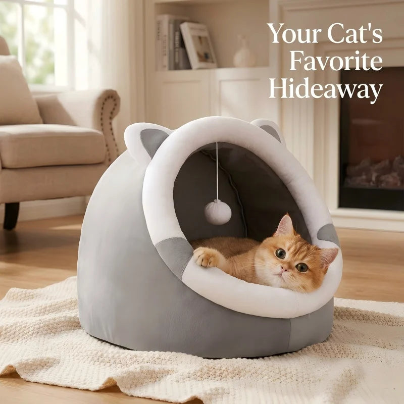 Cat lying in a gray pet bed with 'Your Cat's Favorite Hideaway' text in a cozy living room.