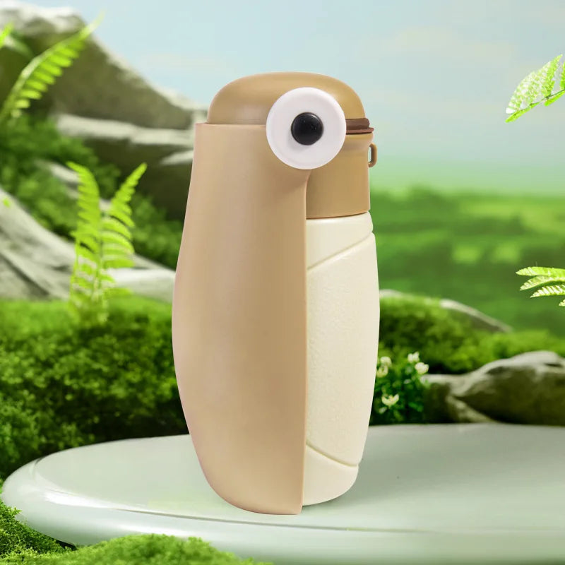 Beige and white device resembling a penguin on a green natural background