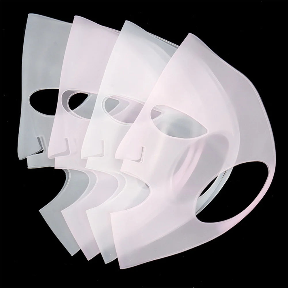 Set of white face masks on a black background