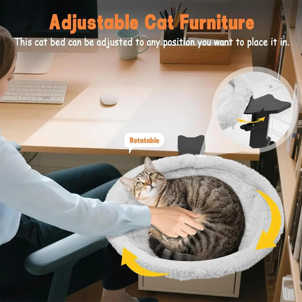 Cat bed being adjusted on a desk with a cat inside, labeled as adjustable cat furniture.