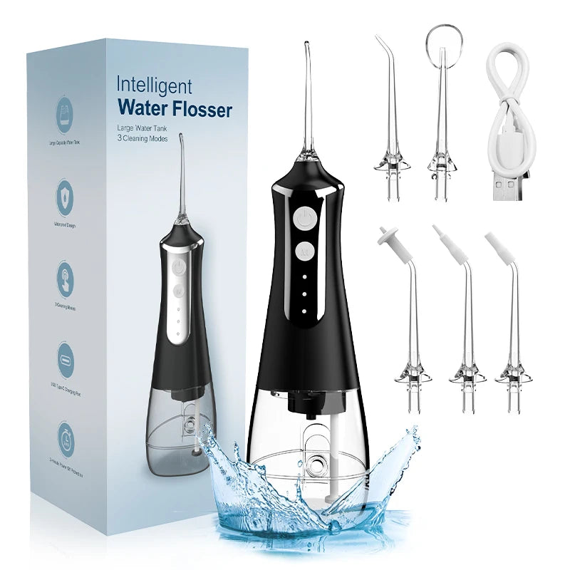 Black water flosser with packaging, nozzles, and USB cable on a white background
