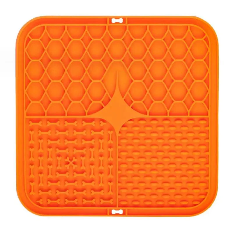 Orange silicone mat with textured design on a white background