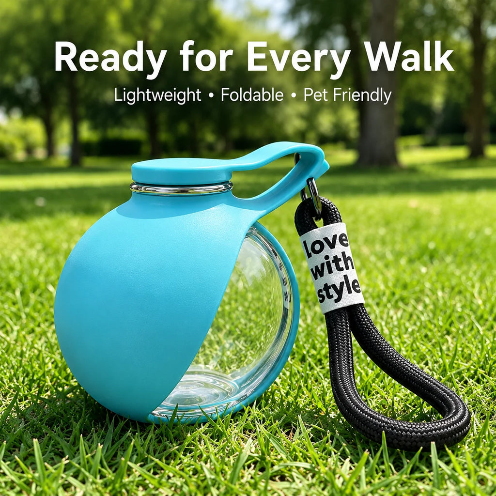 A bright blue reusable water bottle with a clear glass lower section and a black wrist strap, placed on green grass outdoors. White text at the top reads 'Ready for Every Walk' with smaller descriptors 'Lightweight • Foldable • Pet Friendly'.