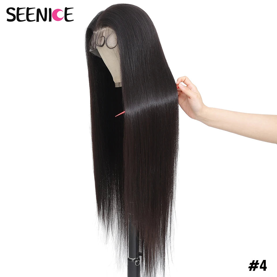 A long, straight black wig displayed on a mannequin stand against a white background, with a hand holding a section of the hair to show texture and shine. The brand name 'SEENICE' is visible in the top left corner, and the shade '#4' is shown in the bottom right.