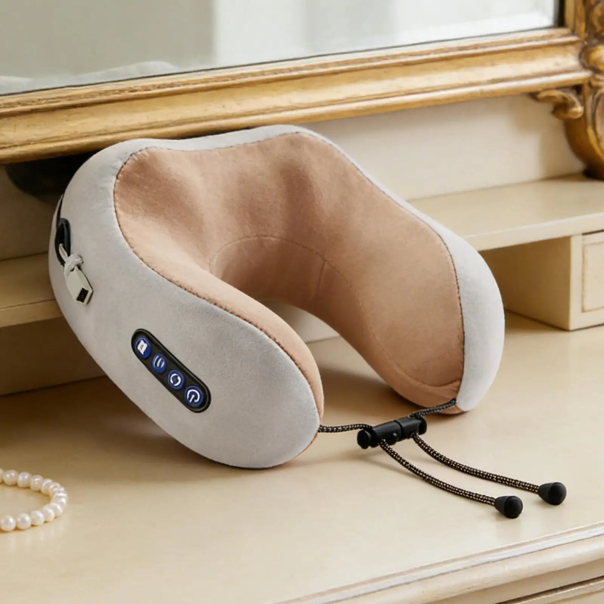 Neck massager on a wooden surface with a mirror in the background