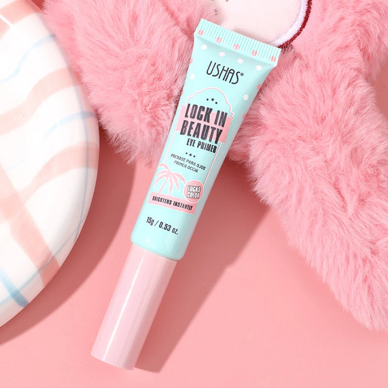 Ushas Lock In Beauty eye primer tube on a pink background