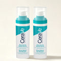 Two bottles of CeraVe Resurfacing Retinol Serum standing side by side on a light beige background.
