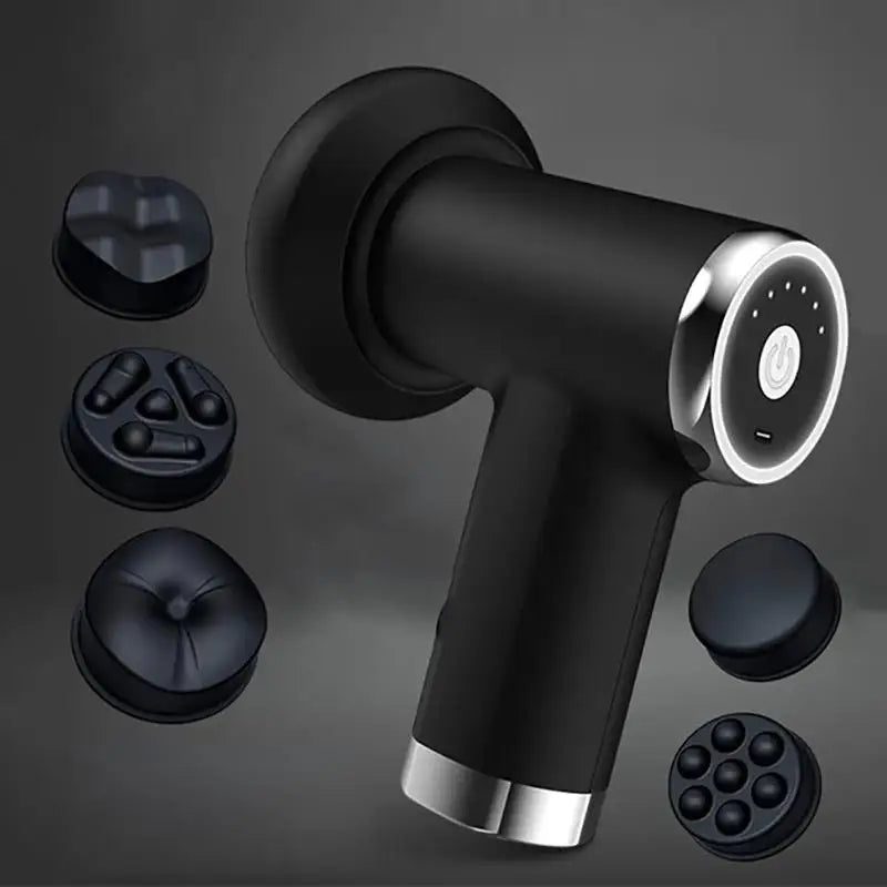 Black handheld massage gun with silver accents, shown with multiple interchangeable massage heads on a dark gray background.