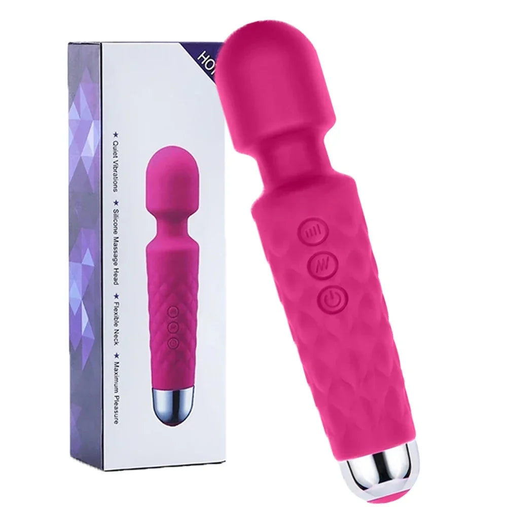 Pink electronic device with buttons next to its packaging on a white background