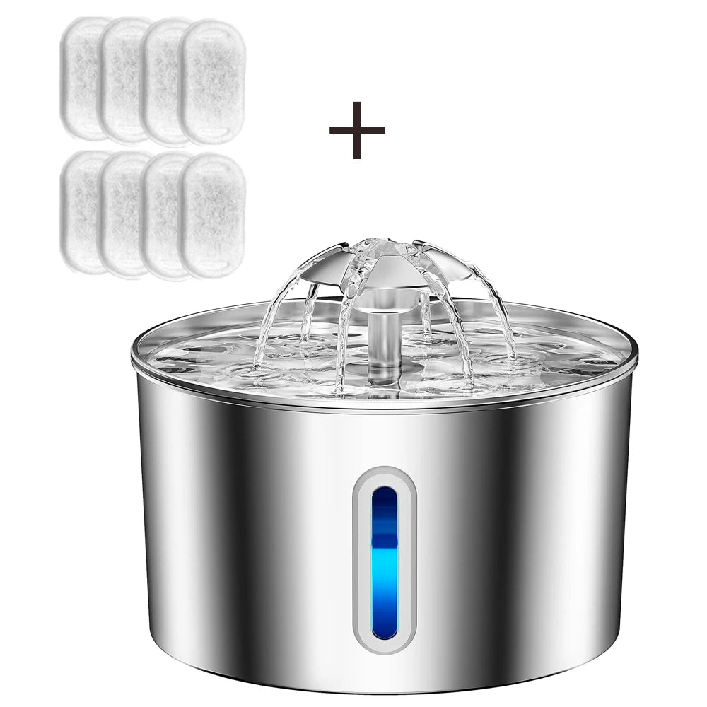 A stainless steel pet water fountain with a water fountain nozzle in the center and a vertical blue LED indicator window on the front. The image includes a plus sign and six white filter pads shown in the upper left, indicating a bundle or included accessories.